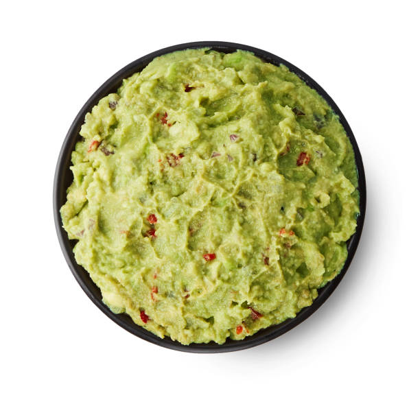 istock Fresh guacamole isolated on white background 1051626526