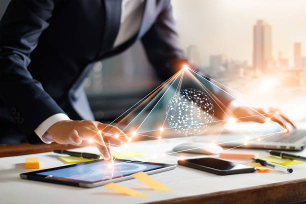 istock Businessman touching tablet and laptop. Management global structure networking and data exchanges customer connection on workplace. Business technology and digital marketing network concept. 1051632482