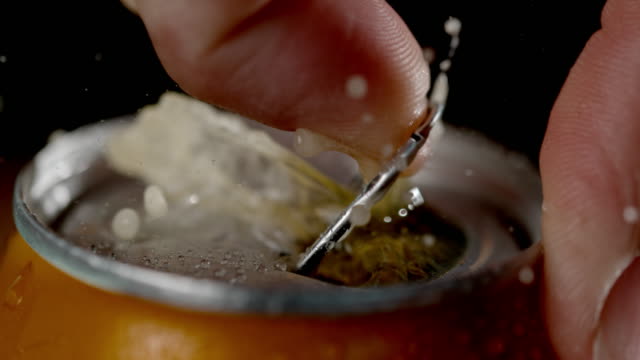 SLO MO Hand opening a can of cold drink