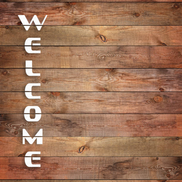 istock Vintage WELCOME sign on natural wooden surface. 1051638494
