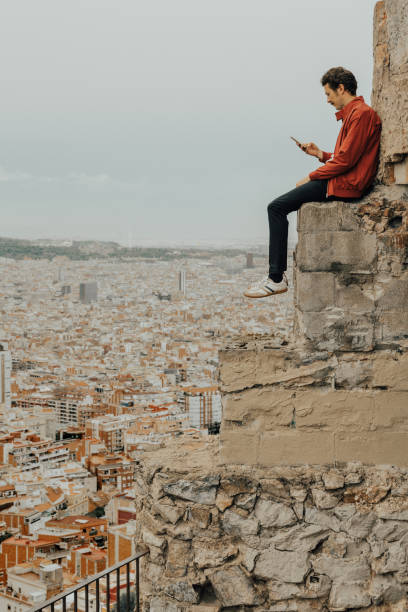 istock Man looking at view over Barcelona 1051641660