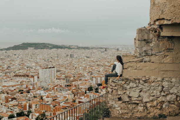 istock Woman looking at view over Barcelona 1051644650
