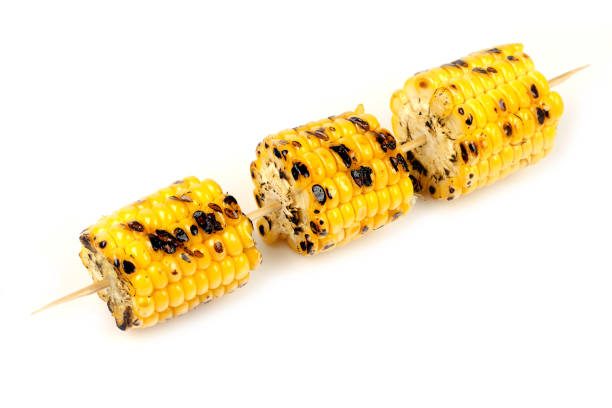 istock corn grill on skewers on white background 1051647868