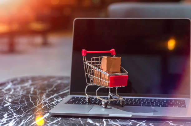 istock Laptop with Shopping Cart 1051654988