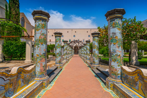 Sunny cloister of the Clarisses decorated with majolica tiles from Santa Chiara Monastery in Naples, Italy. Sunny cloister of the Clarisses decorated with majolica tiles from Santa Chiara Monastery in Naples, Italy. cloister stock pictures, royalty-free photos & images