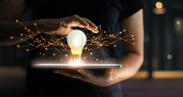 abstract. innovation. hands holding tablet with light bulb future technologies and network connection on virtual interface background, innovative technology in science and communication concept. - poder imagens e fotografias de stock