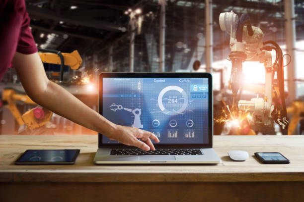 Engineer touching laptop check and control welding robotics automatic arms machine in intelligent factory automotive industrial with monitoring system software. Digital manufacturing operation.Industry 4. Engineer touching laptop to check and control welding robotics automatic arms machine in intelligent factory automotive industrial with monitoring system software. Digital manufacturing operation.Industry 4.0 car engineer stock pictures, royalty-free photos & images