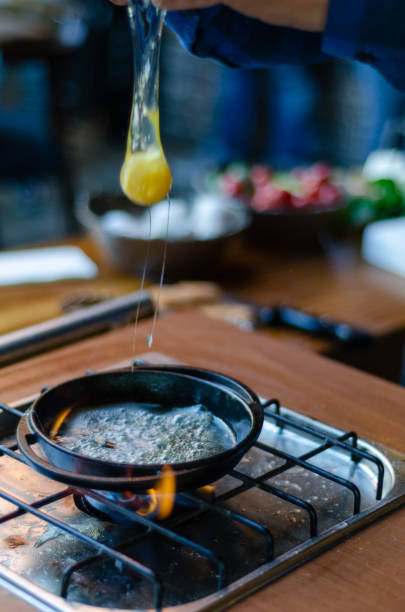 istock The chef broke the egg into the pan. 1051663588