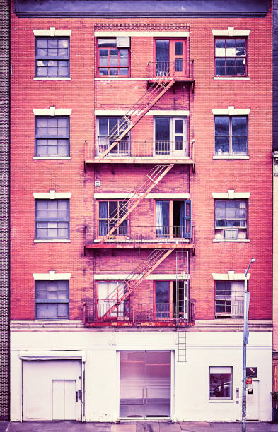 istock Building with fire escapes in New York City. 1051663934