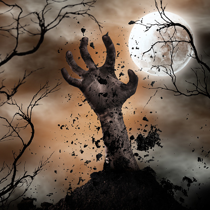 Scary Halloween background with zombie hand. Horror theme.