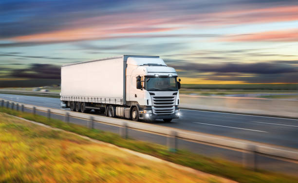 istock Truck with container on road, cargo transportation concept. 1051669478