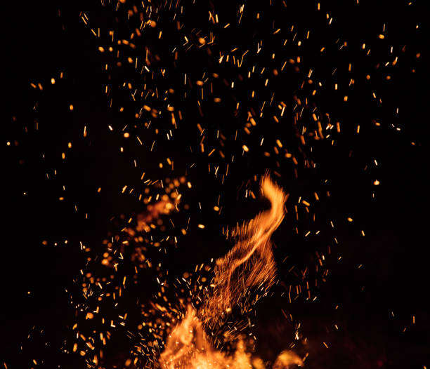 Burning sparks flying. Beautiful flames background. stock photo