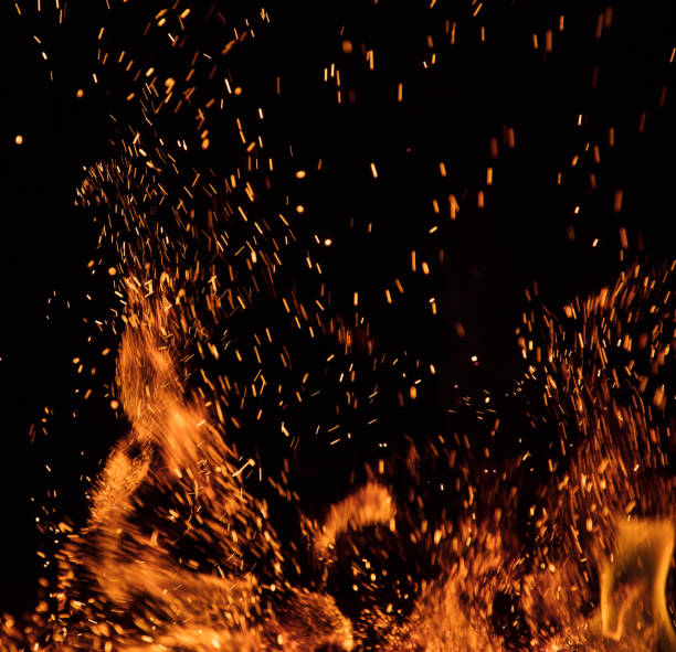 istock Burning sparks flying. Beautiful flames background. 1051669598