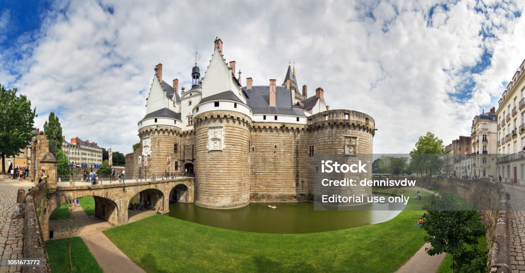 Nantes castle panorama Beautiful panoramic cityscape view of The Château des ducs de Bretagne (Castle of the Dukes of Brittany) a large castle located in the city of Nantes, France Nantes Stock Photo