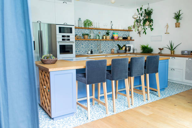 istock Fresh summer breakfast in Mediterranean style kitchen. Bright and sunny space with a lot of herbs and plants. 1051678302