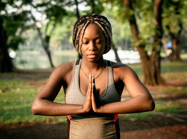 istock People yoga in a park 1051678960
