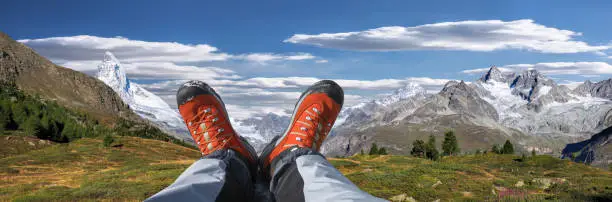 Swiss Alps with hiking boots in Zermatt area, Switzerland