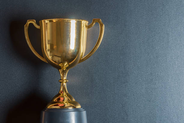 istock Golden trophy on black background 1051683680