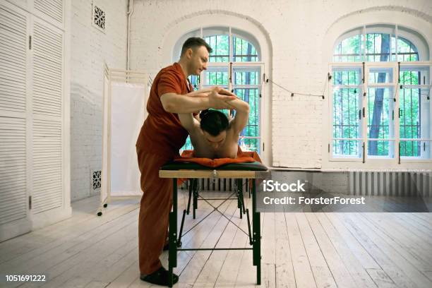 Manual Therapist With Patient Stock Photo - Download Image Now - Adult, Back, Bending