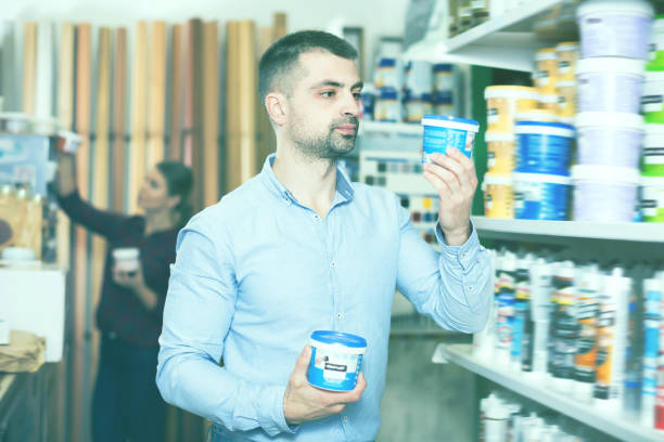 istock Cheerful male designer is holding paint 1051694074