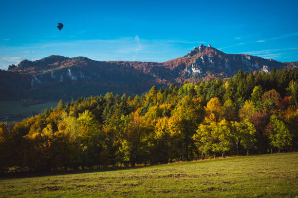 istock Balloon flying in colorful autumn nature 1051694886