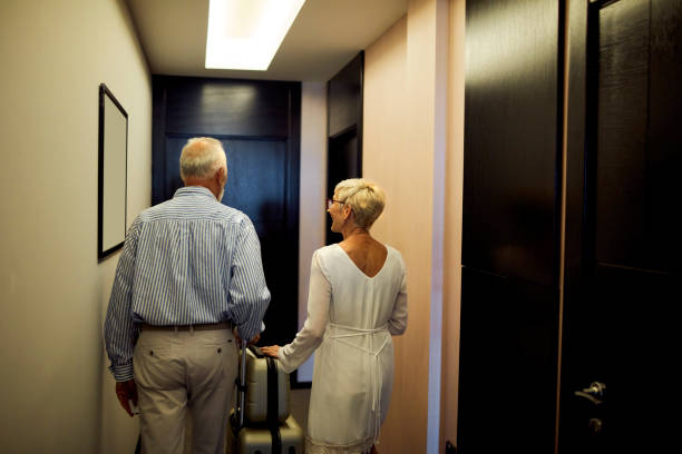 istock Senior Couple Coming To A Hotel 1051698924