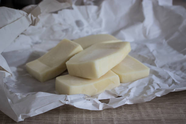 istock Pieces of cheese Eidam isolated on white background 1051702866