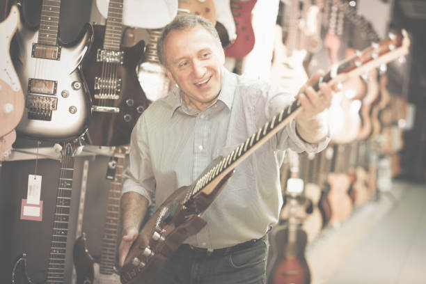 istock Man is playing on electric guitar 1051704760