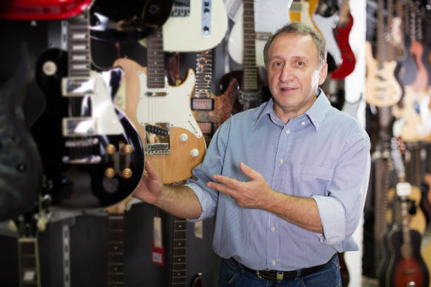 istock male is standing with modern guitar 1051706616