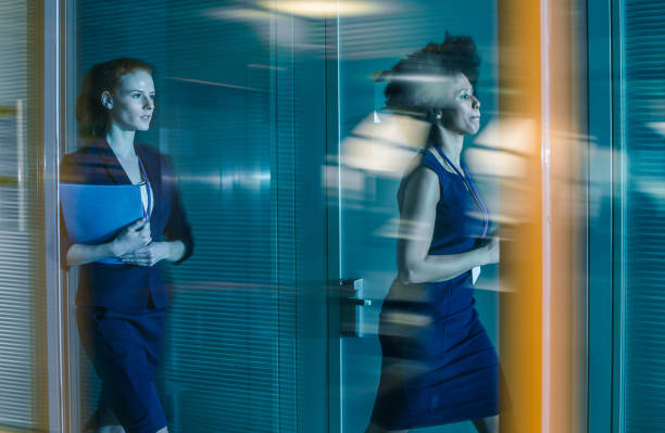 istock Businesswomen Walking Down The Hallway 1051712516