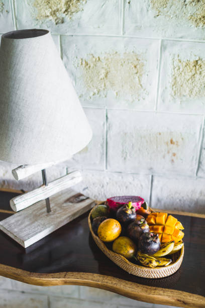 Fruit plate with mango, passion fruit, mangosteen, dragonfruit on wooden table