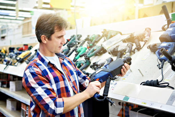 istock Man shopping for perforator in hardware store 1051717670