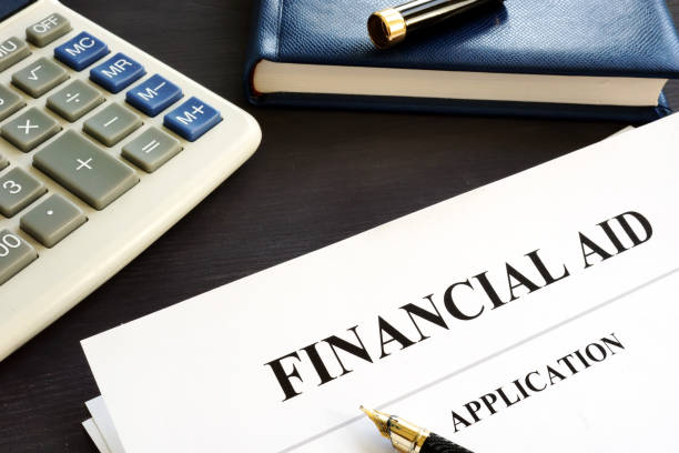 istock Financial aid application on a desk. Student loan. 1051719980