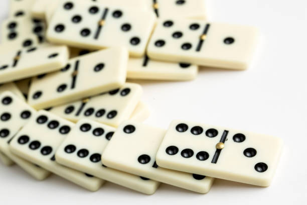 istock Falling dominoes. Domino effect. The domino game. 1051719996