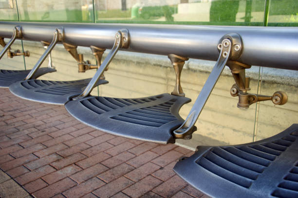 istock Silver metalic designed seats in the bus stop 1051720066