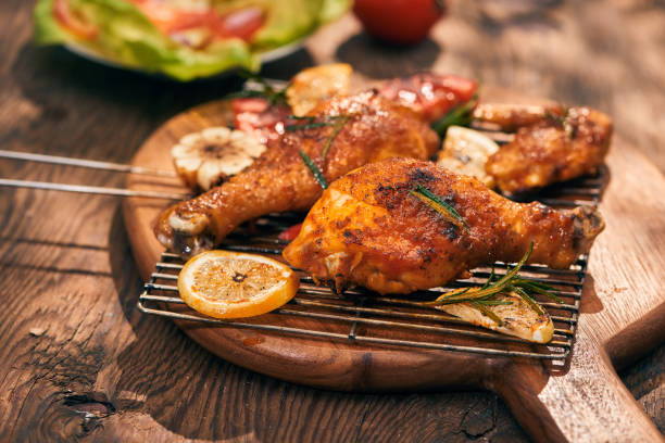 istock Grilled bbq chicken with fresh herbs and tomatoes 1051720080