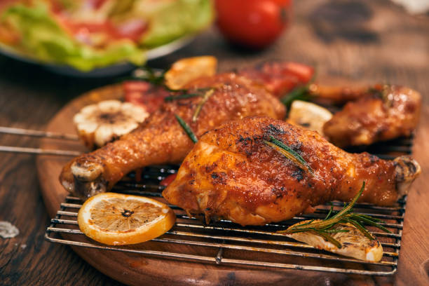 istock Grilled bbq chicken with fresh herbs and tomatoes 1051720082