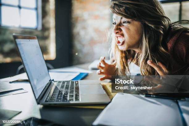 Frustrated Woman Received A Problematic Email Over Computer Stock Photo - Download Image Now