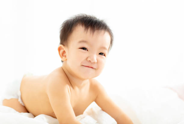 Happy asian little baby smiling