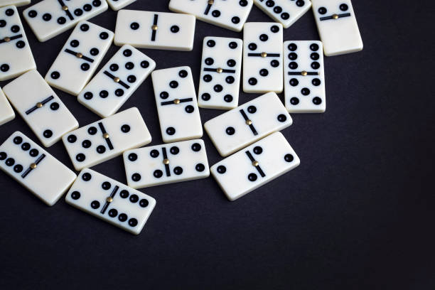 istock Falling dominoes. Domino effect. The domino game. 1051720190