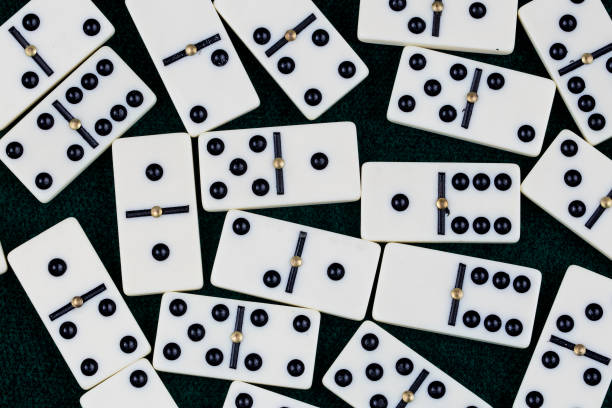 istock Falling dominoes. Domino effect. The domino game. 1051720202