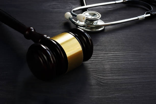 istock Gavel and stethoscope. Medical negligence concept. 1051720244