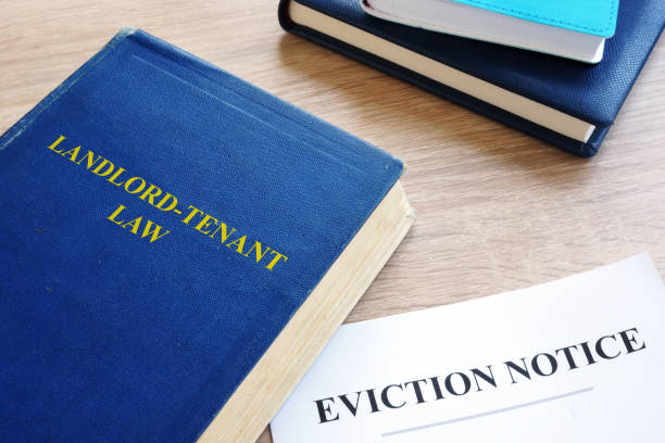 Landlord-Tenant Law and eviction notice on a desk. Landlord-Tenant Law and eviction notice on a desk. eviction photos stock pictures, royalty-free photos & images