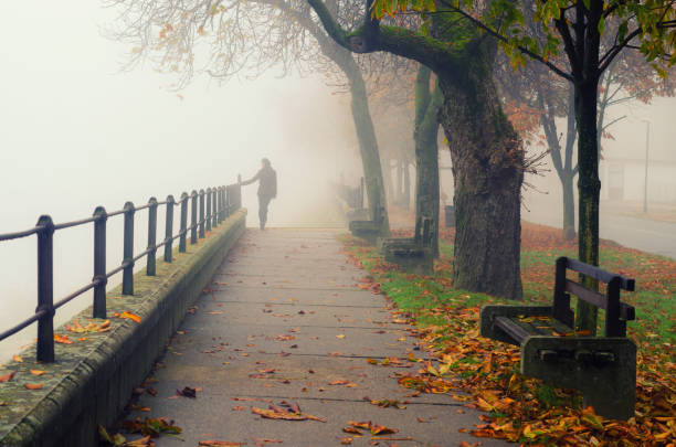 istock Woman outdoors on misty autumn day 1051720578
