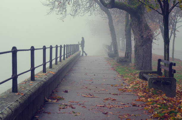istock Woman outdoors on a misty autumn day 1051720628