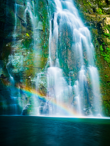 Rainbow with waterfall in mountain