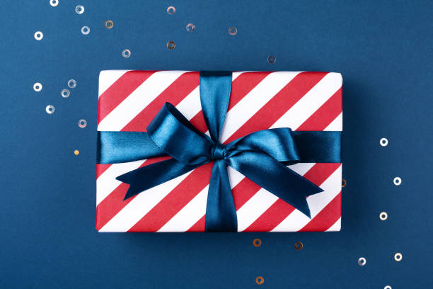 istock Gift box with blue ribbon. 1051728860