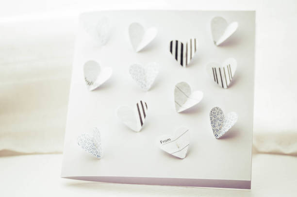 Close up of paper art with butterfly heart, made from recycled paper