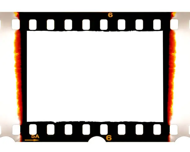 Photo of Old 35mm dia film frame with burned edges on white