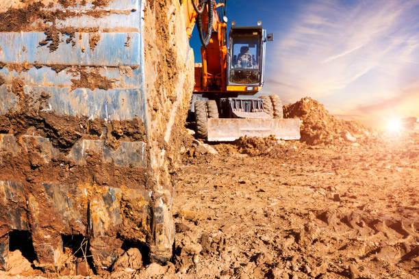 istock Excavator bucket. Huge excavator in the evening. 1051759214